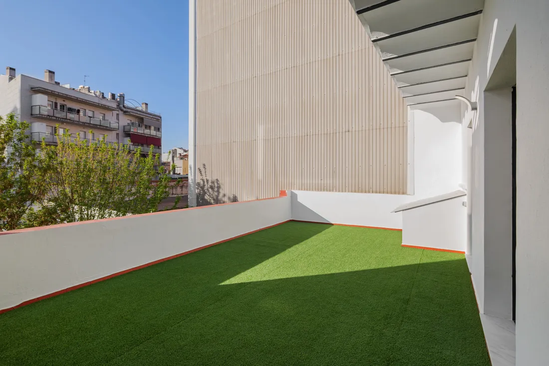 Artificial turf laid in a small courtyard space